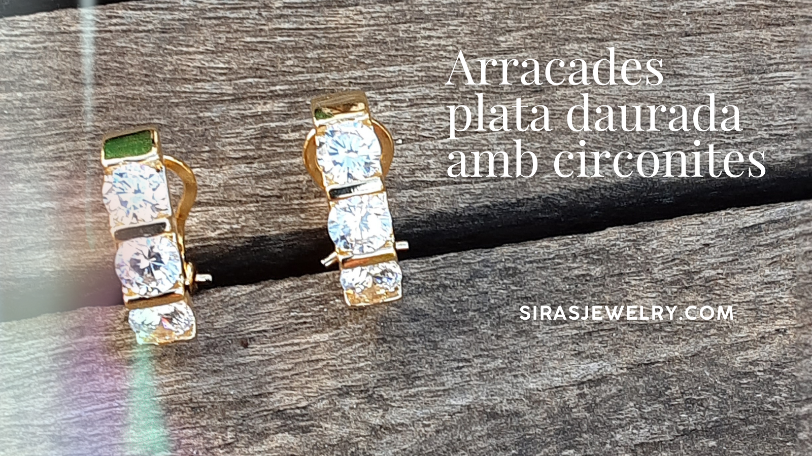 Arracades plata daurada amb circonites